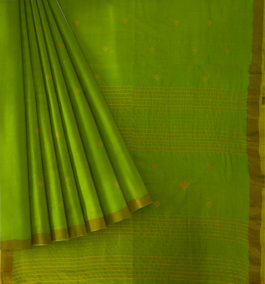 A bright lime green silk saree with gold zari woven patterns, shown with the fabric elegantly draped and folded.