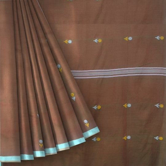 A brown silk saree with small yellow and white floral motifs and a white stripe border, shown with the fabric elegantly draped.